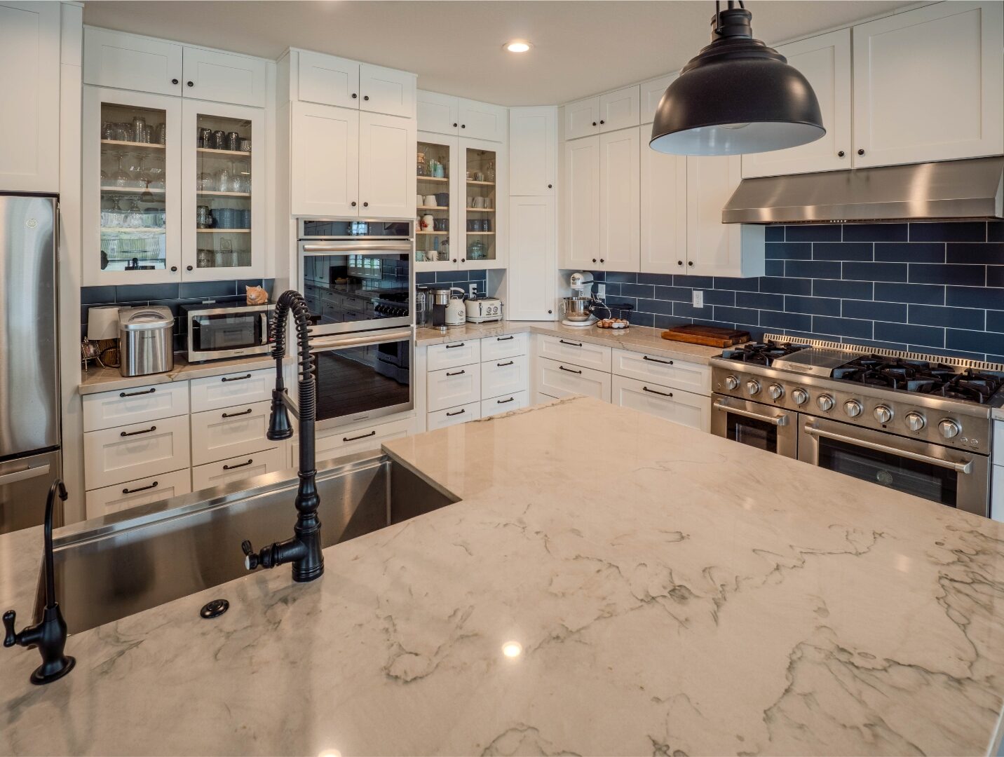 Marble kitchen island countertop with farmhouse sink