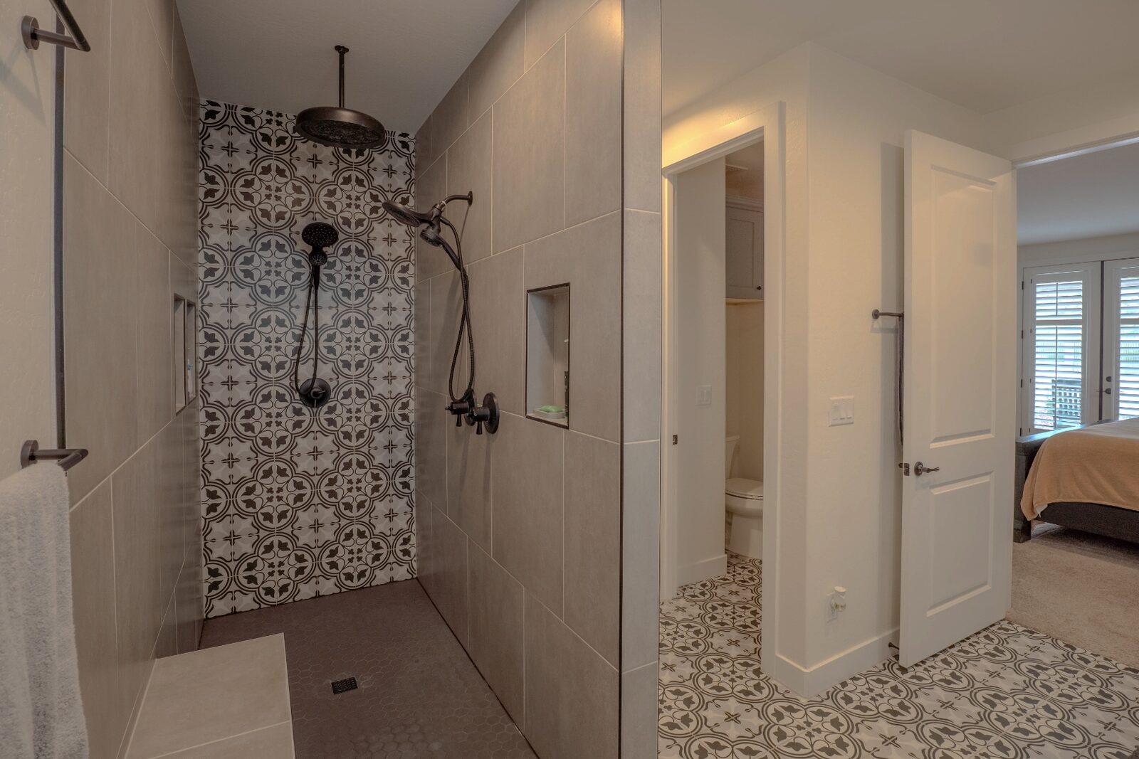 Walk-in shower with designer patterned tile wall
